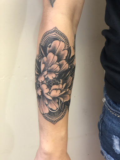 Explore grave tattoo ideas, creative tattoo ideas in Green Bay, available at Skinny Buddha Tattoo