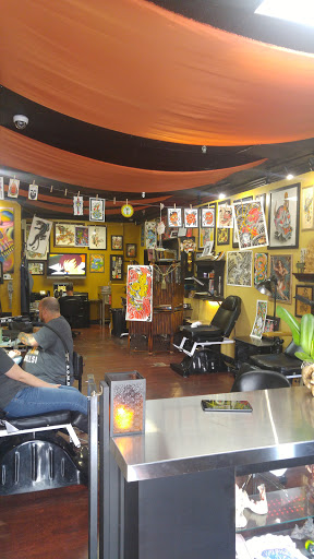 Explore broken heart tattoo ideas for guys, creative tattoo ideas in Miami, available at Almost Famous Tattoo Parlour