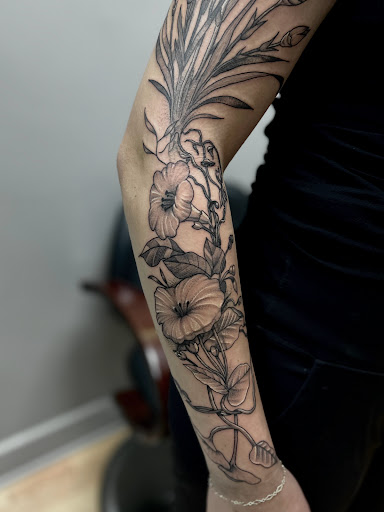 Explore quarter sleeve tattoo ideas for females, creative tattoo ideas in Menomonie, available at Blue Dragon Tattoo