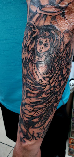 Explore matching tattoos for father and son ideas, creative tattoo ideas in Englewood, available at The Original Big Daddy Tattoo & Body Piercing est.1997 est.1997