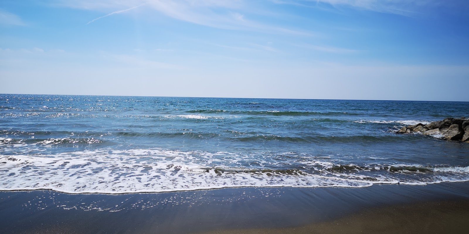 Valokuva Spiaggia Attrezzataista. puhtaustasolla keskipitkä