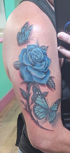 Explore rose and butterfly tattoo ideas, creative tattoo ideas in Cape Coral, available at The Tattoo Emporium