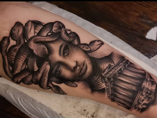 Find under the breast tattoo ideas for your next unique tattoo in Valdosta at Acid Ink Tattoos