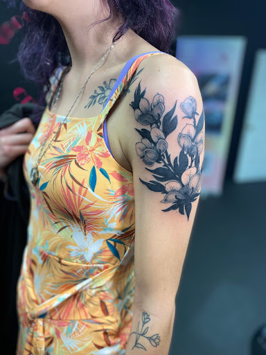 Explore sleeve tattoo ideas for women, creative tattoo ideas in Lake City, available at Crooked Spines Tattoo Studio