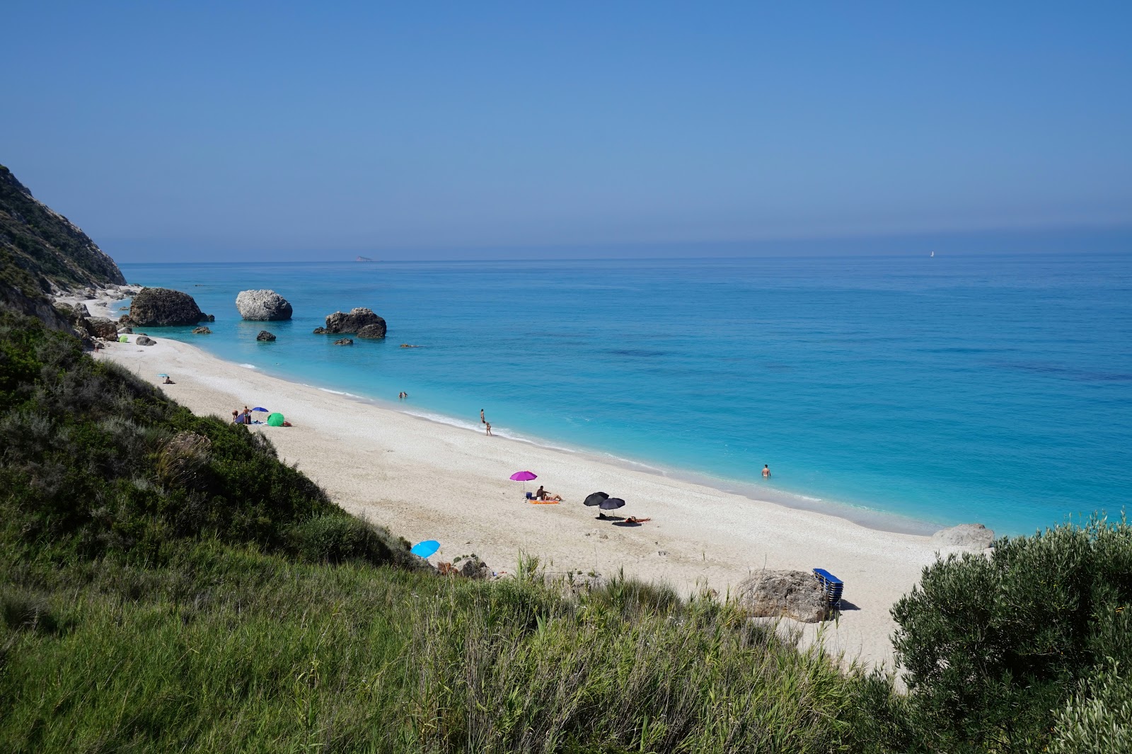 Photo of Megali Petra beach with turquoise pure water surface