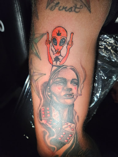 Explore cover up tattoo ideas for leg, creative tattoo ideas in Angola, available at Hoodlum Ink