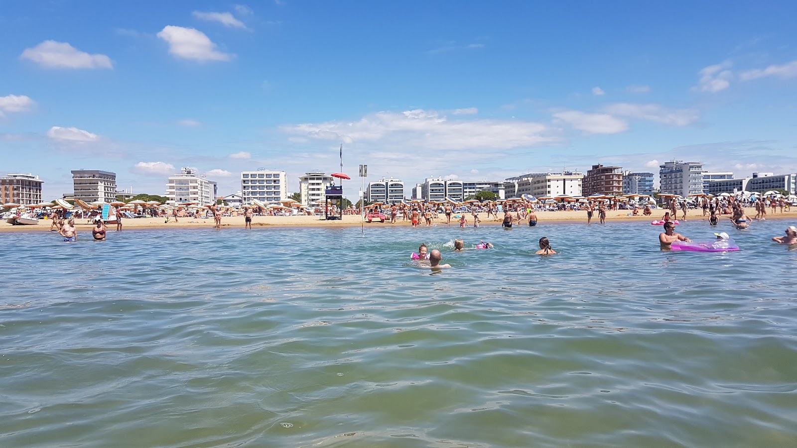 Photo of Bibione Beach with turquoise pure water surface
