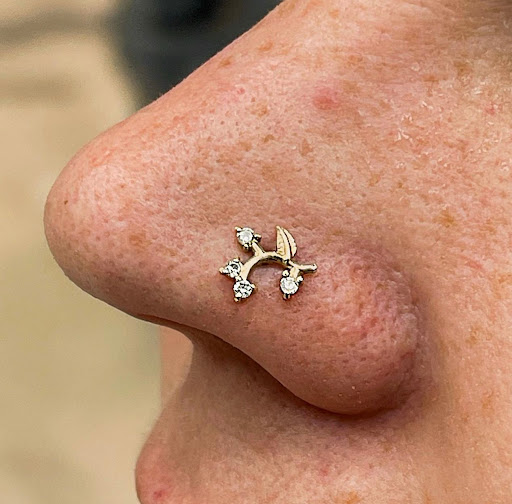 Explore belly button tattoo ideas, creative tattoo ideas in San Antonio, available at Platinum Body Piercings