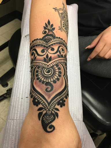 Explore rock n roll tattoo ideas, creative tattoo ideas in Fargo, available at Golden Dragon Tattoo