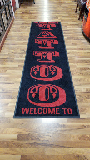 Explore flower spine tattoo ideas, creative tattoo ideas in Avon, available at Altered Image Tattoo and Piercing Studio