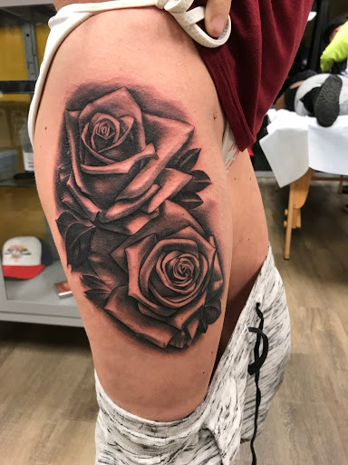 Explore red bird tattoo ideas, creative tattoo ideas in Channahon, available at Supersauce Tattoo Company