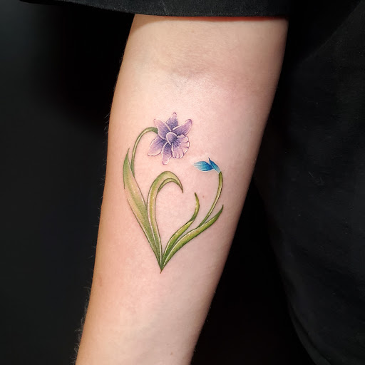Explore tattoo flag ideas, creative tattoo ideas in Stevens Point, available at International Ink Tattoos