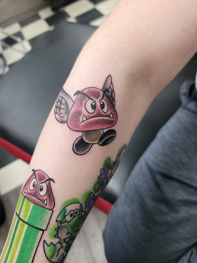 Explore cute neck tattoo ideas, creative tattoo ideas in Green Bay, available at Sonic Tattoos