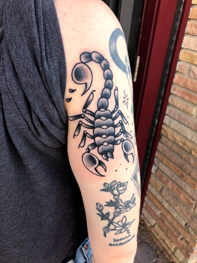 Explore dog love tattoo ideas, creative tattoo ideas in Tucson, available at The Painted Lady Tattoo