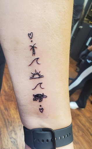 Explore bass guitar tattoo ideas, creative tattoo ideas in Ozone Park, available at Pete & Cubos Tattooing & Body Piercing