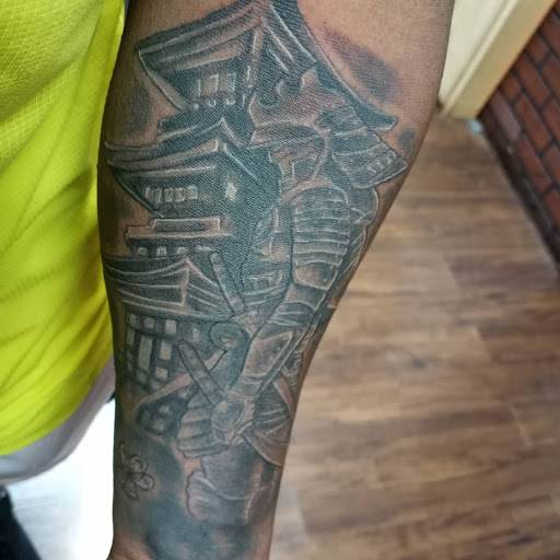 Explore dobby tattoo ideas, creative tattoo ideas in Covington, available at Arts Ink Tattoo Studio