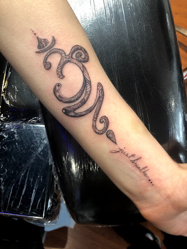 Explore wolf tattoo ideas for guys, creative tattoo ideas in Scarsdale, available at Damm Nice Tattoo & Body Art