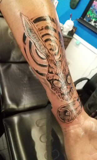 Explore good hand tattoo ideas, creative tattoo ideas in Tarpon Springs, available at Legacy Blue Tattoo Studio and Laser Removal