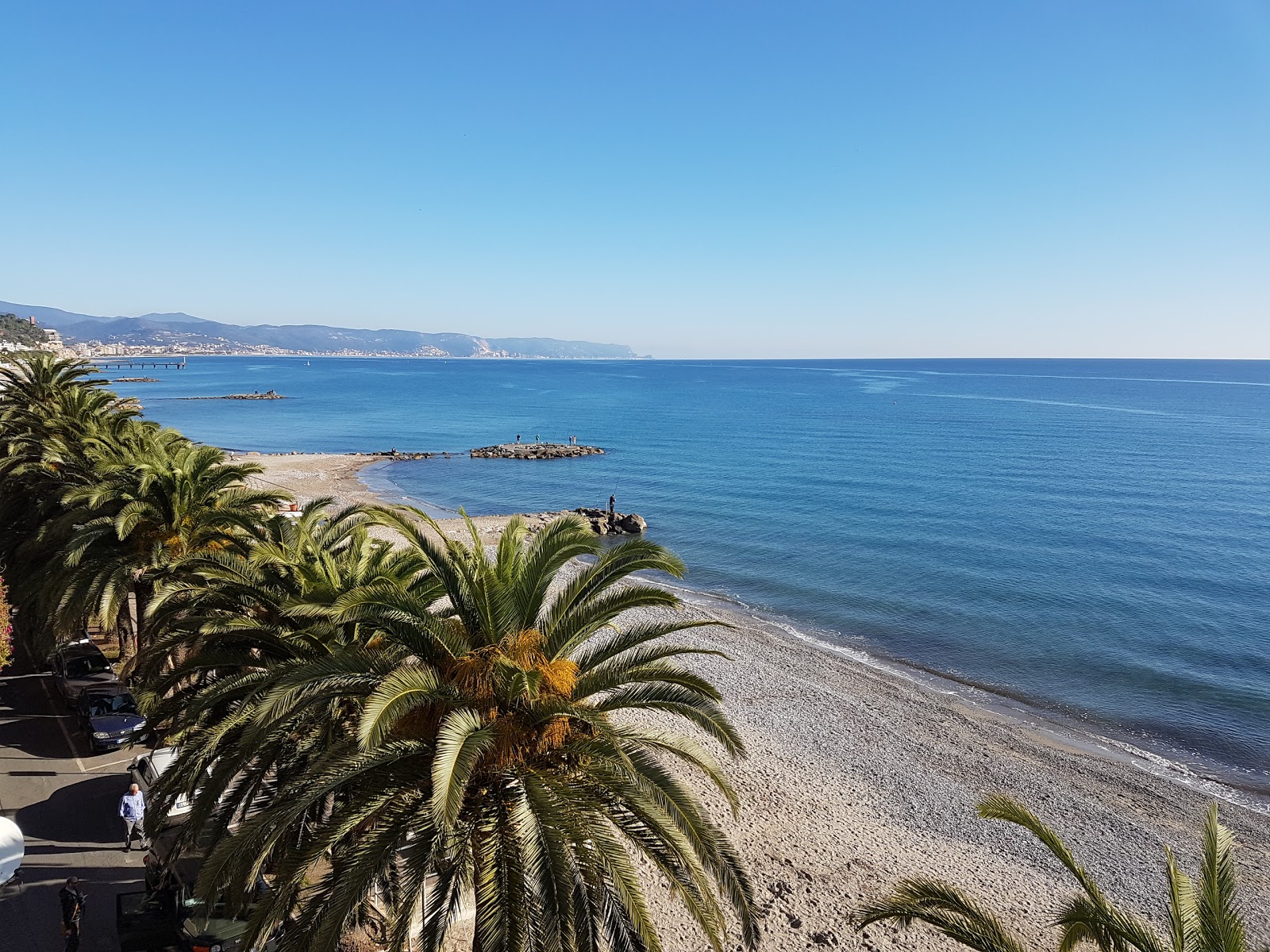 Foto av San Sebastiano beach med musta hiekka ja kivi yta