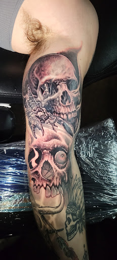 Explore venom tattoo ideas, creative tattoo ideas in Angola, available at Hoodlum Ink