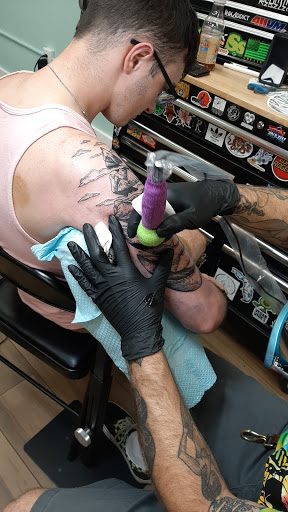 Explore kingfisher tattoo ideas, creative tattoo ideas in Cocoa Beach, available at 13 Waves Tattoo