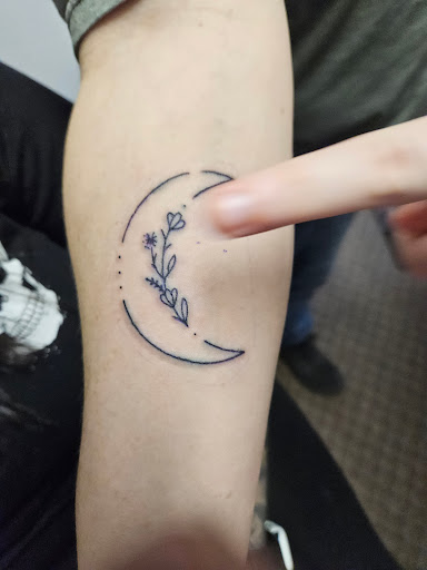 Explore butterfly spine tattoo ideas, creative tattoo ideas in Angola, available at Hoodlum Ink