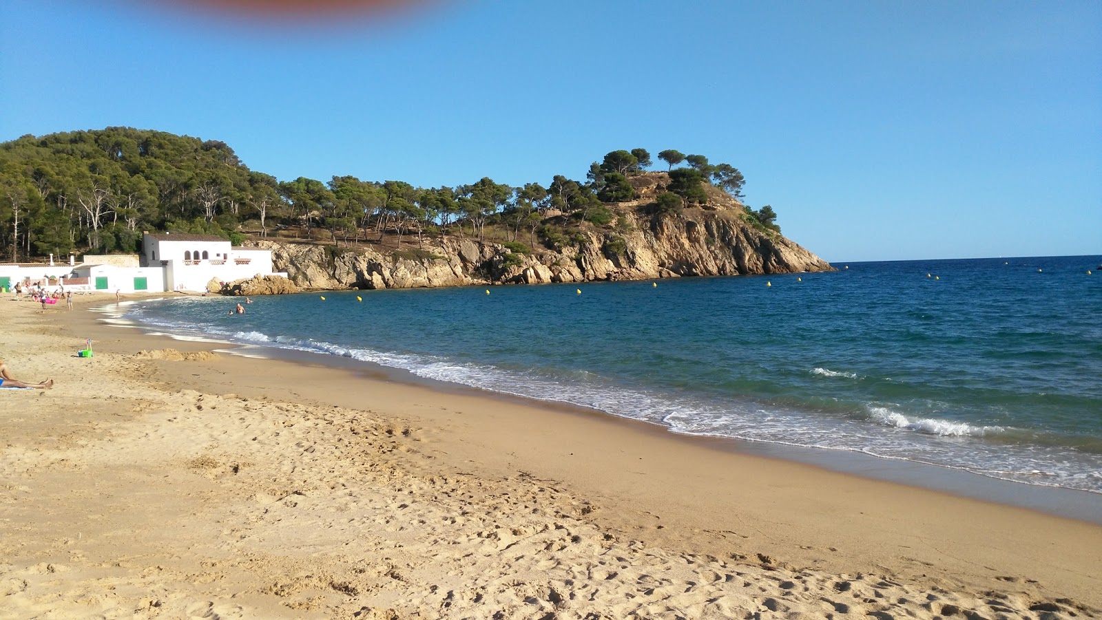 Foto van Castell de la Fosca Strand met kleine baai