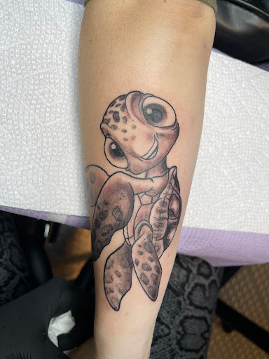 Explore surfboard tattoo ideas, creative tattoo ideas in Greensboro, available at Golden Spiral Studios