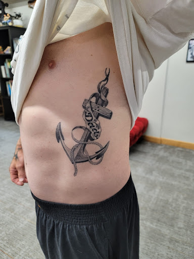 Explore upper back tattoo ideas for guys, creative tattoo ideas in Saint Paul, available at Gabriels Fallen Angel Tattoo Studio