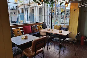 THE BUZZ, coffee house, Greek meze kitchen, licensed bar, meet-up spaces & hot desk studio image