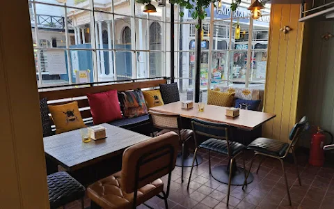 THE BUZZ, coffee house, Greek meze kitchen, licensed bar, meet-up spaces & hot desk studio image