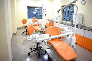 Riya's Dental Care I Root Canal Clinic I Implants I Dentures I Aligners I image