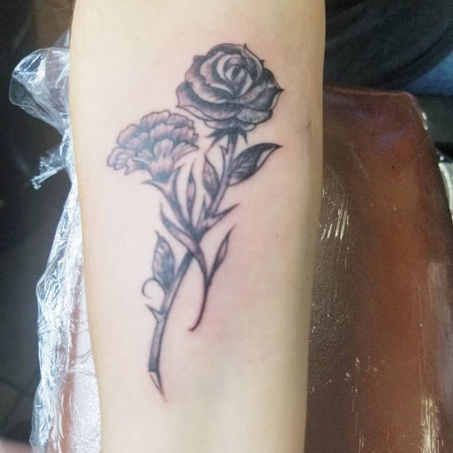 Explore throat tattoo ideas for males, creative tattoo ideas in Buffalo, available at Madd Ink Tattoo & Piercing