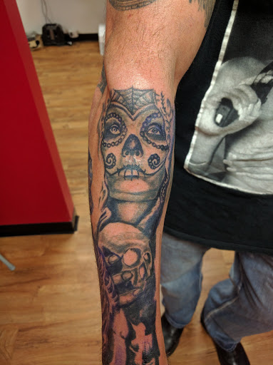Explore rapper tattoos ideas, creative tattoo ideas in Akron, available at Knuckle Up Ink Tattoos