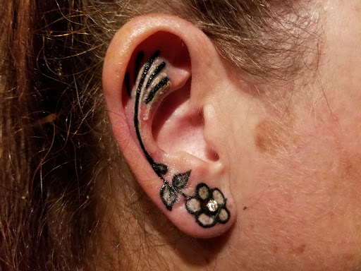 Explore dogwood tree tattoo ideas, creative tattoo ideas in Hastings, available at Outlaw Tattoo Co