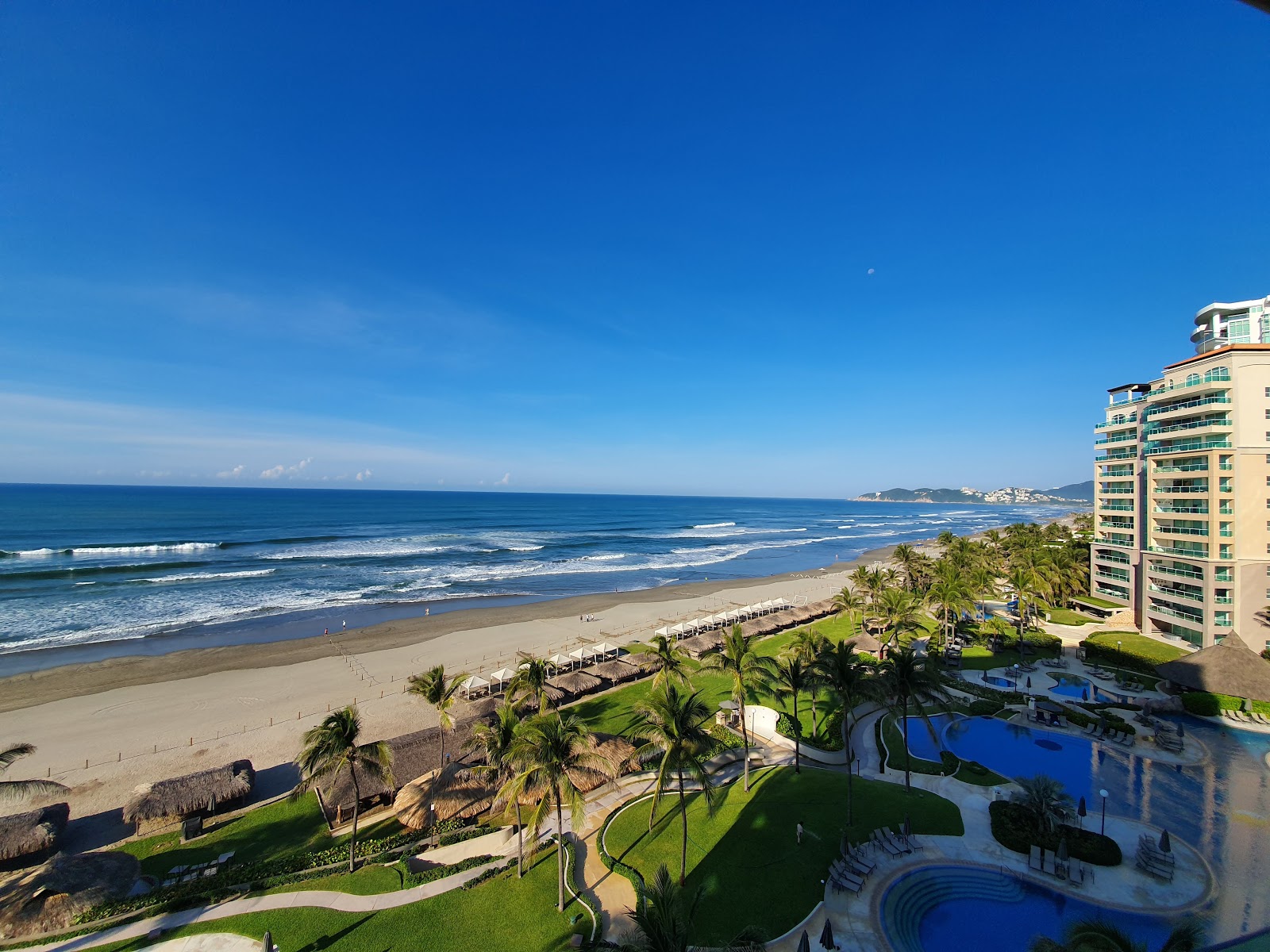 Foto von Playa Sea Garden mit türkisfarbenes wasser Oberfläche