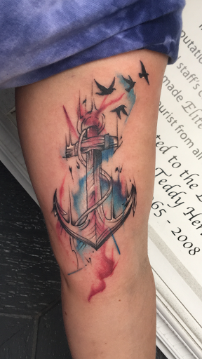 Find tattoo ideas for woman on leg for your next unique tattoo in Myrtle Beach at Elite Ink Tattoos of Myrtle Beach