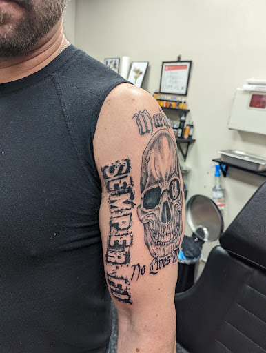Explore tribal head tattoo ideas, creative tattoo ideas in Slippery Rock, available at Dinky Dachshund Tattoo Parlor