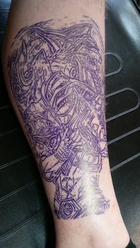 Explore lower back tattoo ideas for men, creative tattoo ideas in Ponchatoula, available at Rougarou Collective Tattoo Shop