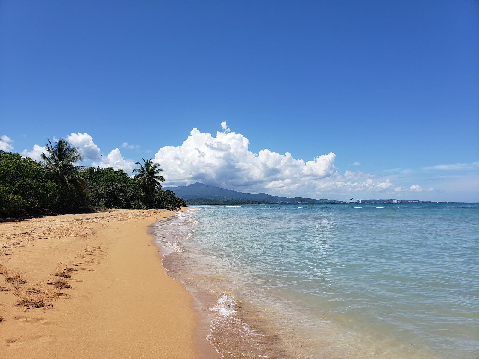 Photo of Playa Escondida with bright fine sand surface