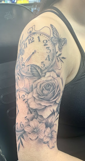 Explore iris flower tattoo ideas, creative tattoo ideas in Cincinnati, available at UniquInk Tattoos & Piercings