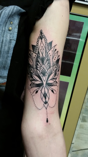 Explore mens sleeve tattoo ideas with meaning, creative tattoo ideas in Flint, available at Electric Chair Tattoo