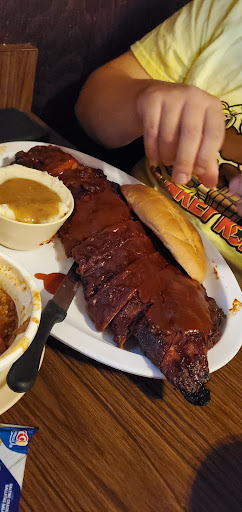 Rack of baby back ribs with smashed potatoes/gravy, and garlic bread