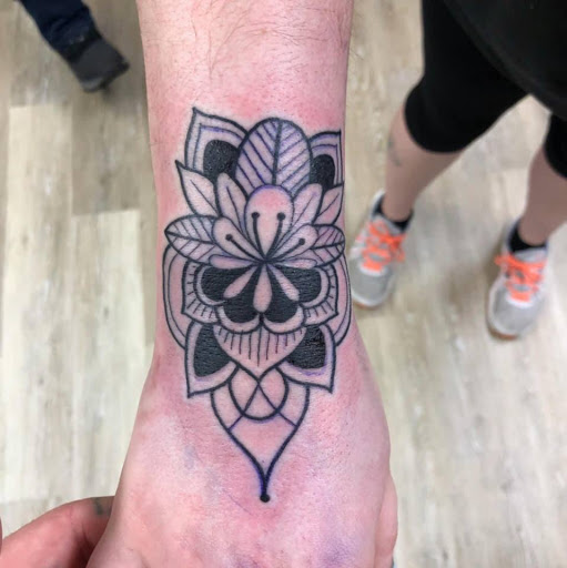 Explore locket tattoo ideas, creative tattoo ideas in Houghton Lake, available at Screaming Eagle Tattoo