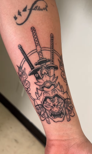 Explore 2 initial tattoo ideas, creative tattoo ideas in Orange, available at Top Floor Tattoo Studio