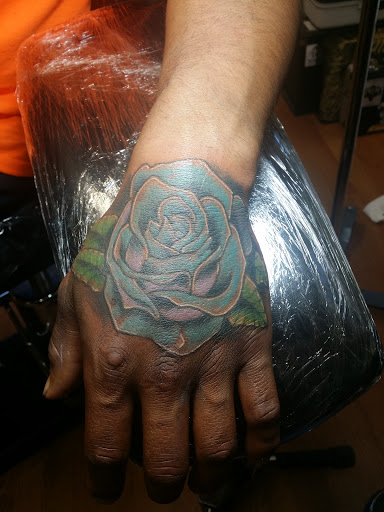 Explore purple rose tattoo ideas, creative tattoo ideas in Wenatchee, available at Rebels Tattoo Studio