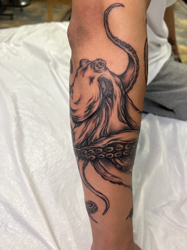 Explore mens cross tattoo ideas, creative tattoo ideas in Adrian, available at Good Life Tattoo Co.