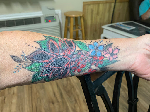 Explore sleeve tattoo fill in ideas, creative tattoo ideas in Winnsboro, available at Dirty Looks Tattoo Studio