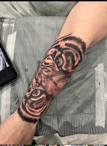 Explore massage therapy tattoo ideas, creative tattoo ideas in Kingsford, available at Deft Tattoo Studio