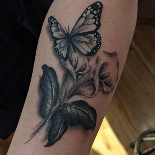 Explore trash polka tattoo ideas, creative tattoo ideas in Lake Villa, available at Eternal Tiger Tattoo